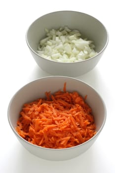 Cut carrot  and onion in bowls