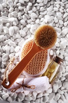 brush and toiletries on the white pebble