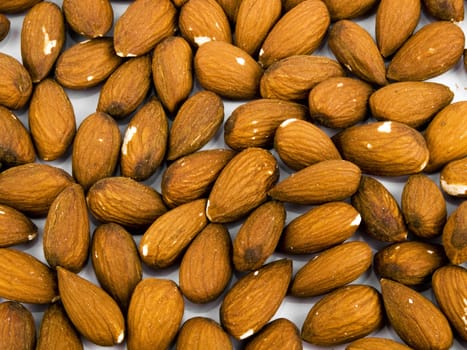 The background of almonds on white background