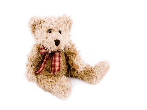 Brown teddy-bear with red bow on white background.