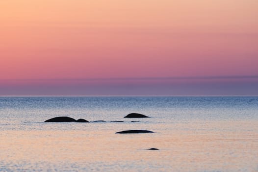 Boulders in the sea. Sunrise in early morning