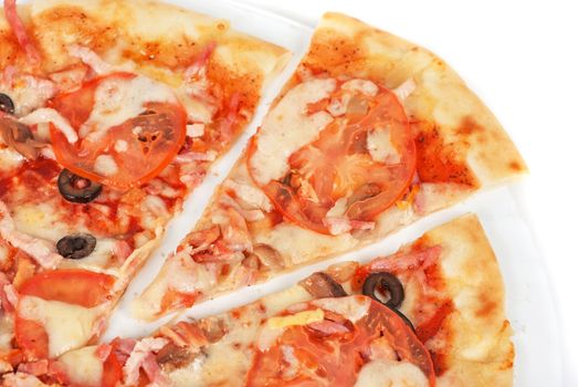 meat pizza closeup with carbonado ham, tomato, olive and mozzarella cheese