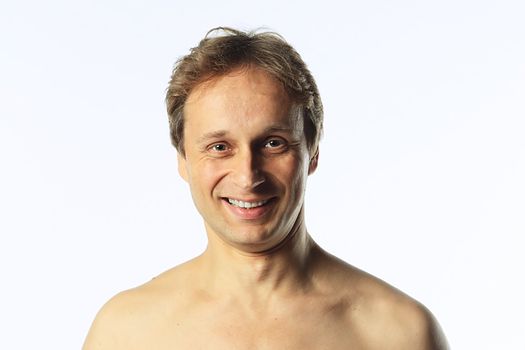 Portrait of a happy middle age man with naked shoulders