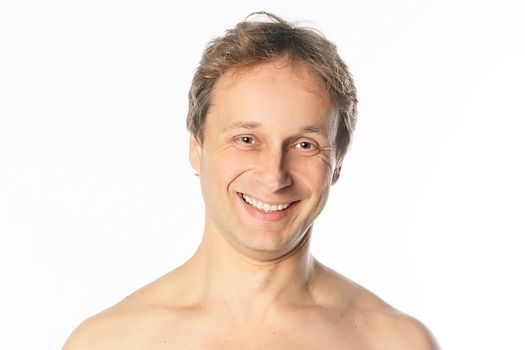 Portrait of a happy middle age man with naked shoulders