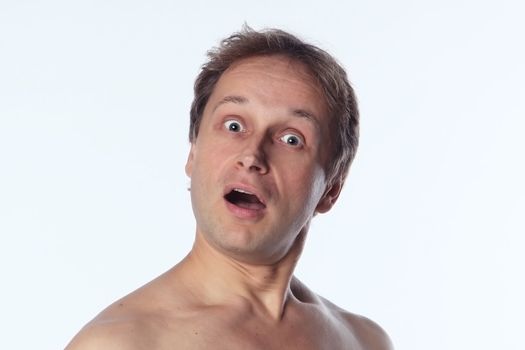 Portrait of a suprise middle age man with naked shoulder