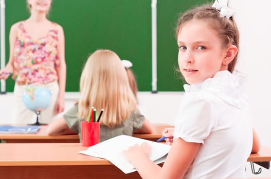 portrait of the girl in the class, the teacher tells the next school board