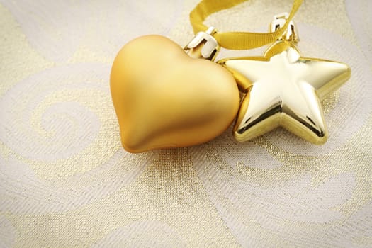 heart shape and golden star ornament side by side