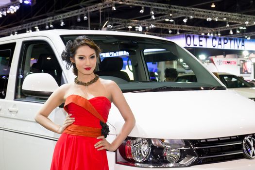 NONTABURI,THAILAND - DECEMBER 3,2011: Unidentified female presenter at booth  Thailand International Motor Expo 2011 on December 3, 2011 in Nonthaburi, Thailand.