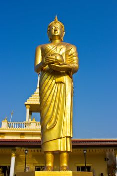 Stand Golden Buddha Statue in Thailand. Buddha was donated to the shared villagers.