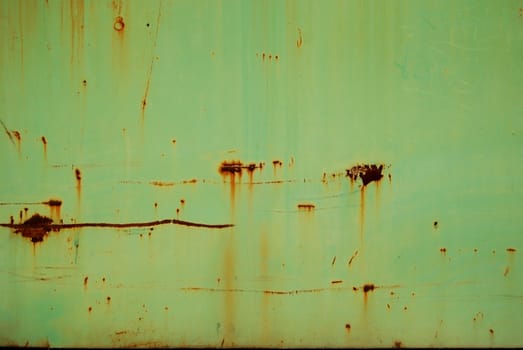 Reseda colored tin rusty stain wall as background