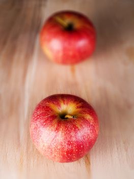 Two red apples in a kitchen