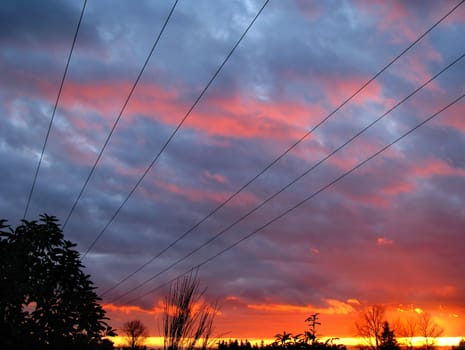 Power Line Sunset Perspective captured with beautiful blue and orange skies.