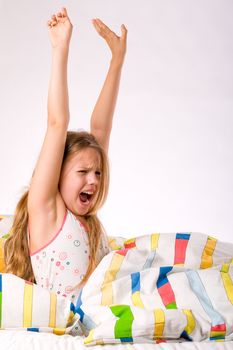 Sleeping young cute child in a colorful bed