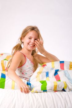 Sleeping young cute child in a colorful bed