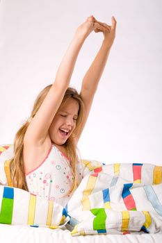 Sleeping young cute child in a colorful bed