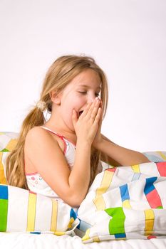 Sleeping young cute child in a colorful bed