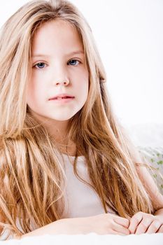 A portrait of a young cute girl in the studio