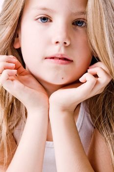 A portrait of a young cute girl in the studio