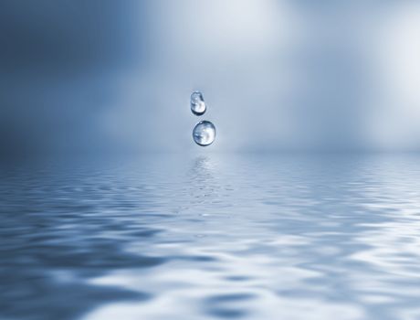 Close up shot of water drops hitting the surface