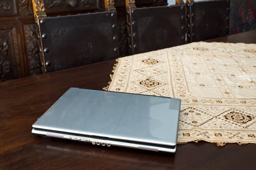 Laptop on antique table