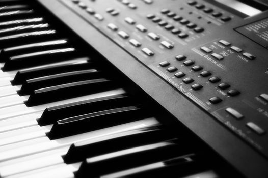 Close-up of an electronic piano keyboard with soft focus