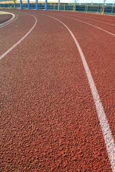 Close up of a running track on sunny day.
