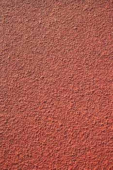 Close up of a running track pavement.
