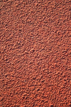 Close up of a running track pavement.
