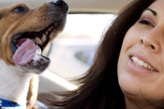 A portrait of a happy girl and her dog.