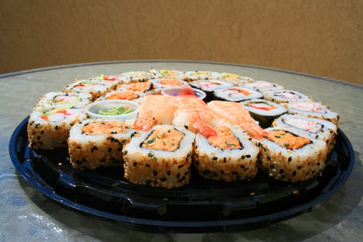 Close up of sushi assortment on a platter.
