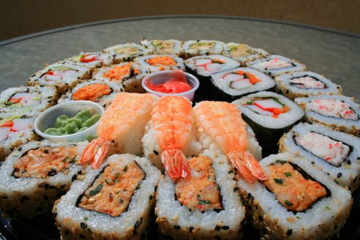 Close up of sushi assortment on a platter.
