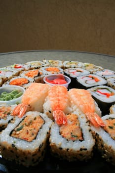 Close up of sushi assortment on a platter.
