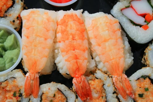 Close up of sushi assortment on a platter.
