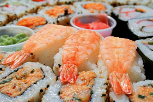 Close up of sushi assortment on a platter.

