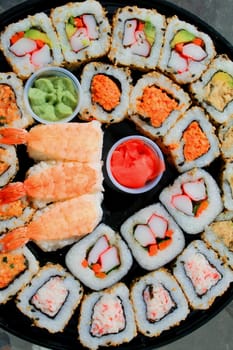 Close up of sushi assortment on a platter.
