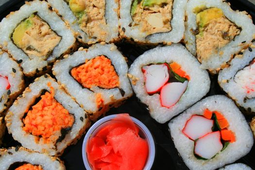 Close up of sushi assortment on a platter.
