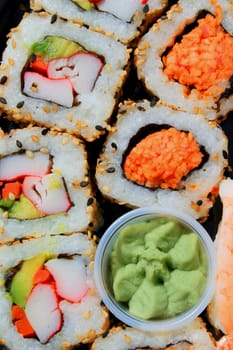 Close up of sushi assortment on a platter.
