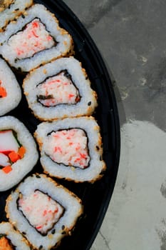 Close up of sushi assortment on a platter.
