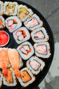 Close up of sushi assortment on a platter.
