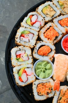 Close up of sushi assortment on a platter.
