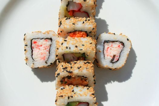 Close up of sushi assortment on a platter.
