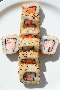 Close up of sushi assortment on a platter.
