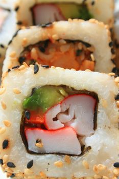 Close up of sushi assortment on a platter.
