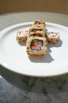 Close up of sushi assortment on a platter.
