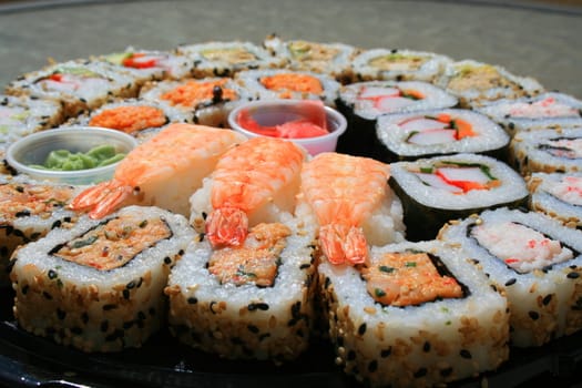 Close up of sushi assortment on a platter.
