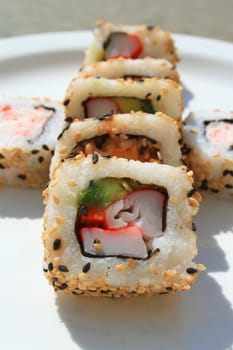 Close up of sushi assortment on a platter.
