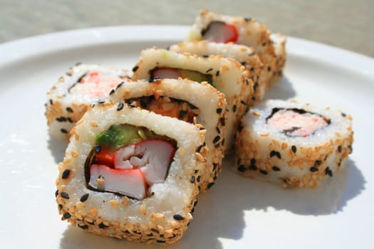 Close up of sushi assortment on a platter.
