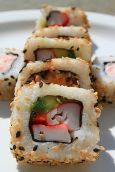 Close up of sushi assortment on a platter.
