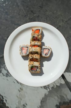 Close up of sushi assortment on a platter.
