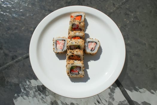 Close up of sushi assortment on a platter.
